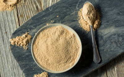 maca powder on cutting board with spoon | Is maca safe during pregnancy?
